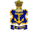 Crest of the Indian Navy featuring a gold-bordered blue octagonal shield enclosing a golden anchor and a small crest, topped by the Ashoka Lion Capital, with a dark blue scroll underneath containing the Sanskrit motto "शं नो वरुणः" in golden script.