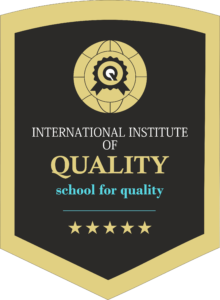 A shield-shaped logo with a gold border and dark background, featuring a gold globe and ribbon emblem at the top, the text "INTERNATIONAL INSTITUTE OF QUALITY school for quality" in the middle, and five gold stars at the bottom.