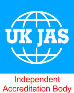 Logo of UK JAS featuring a white globe outline with the bold letters "UK JAS" across the center on a blue background, with the tagline "Independent Accreditation Body" written in red below.